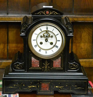 Lot 1256 - Black slate and marble inlaid striking mantel clock