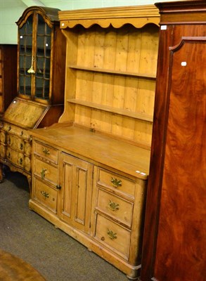 Lot 1263 - A pine dresser and rack