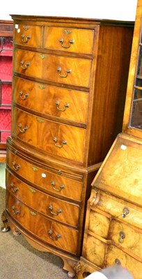 Lot 1265 - A reproduction bow fronted chest on chest