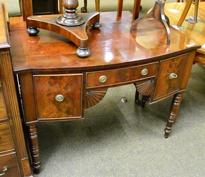 Lot 1299 - A 19th century mahogany bow fronted sideboard of small proportions