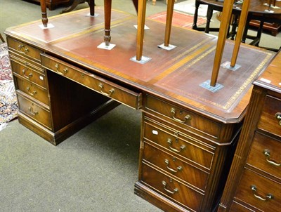 Lot 1303 - Substantial reproduction leather inset twin pedestal desk