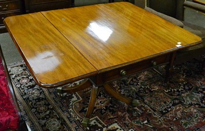 Lot 1309 - A 19th century mahogany pedestal drop leaf table