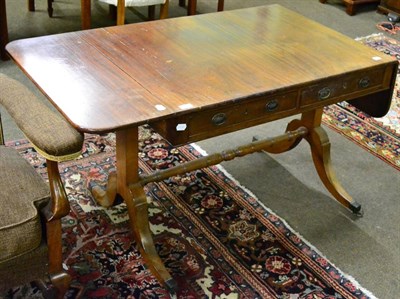 Lot 1311 - A Regency mahogany sofa table, two drawers opposite two dummy drawers