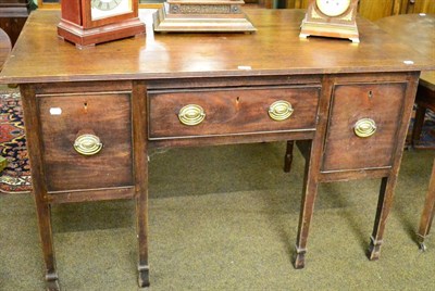 Lot 1316 - A George III mahogany sideboard, single drawer flanked by cellarette drawers, with square...