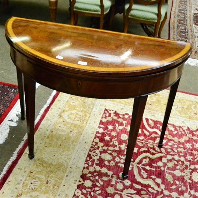 Lot 1339 - A 19th century satinwood inlaid mahogany demi lune tea table