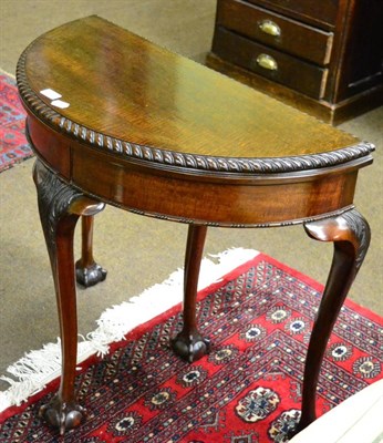 Lot 1342 - A 1920's mahogany card table on ball and claw feet