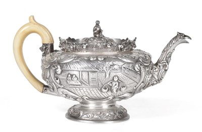 Lot 117 - A George IV Chinoiserie Silver Teapot, Joseph Angell, London 1824, circular on domed pedestal foot