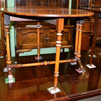 Lot 1358 - A late Victorian burr walnut veneered and inlaid gate leg table