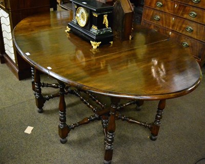 Lot 1373 - A mahogany drop leaf table