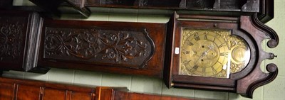 Lot 1379 - A 19th century oak and mahogany longcase clock with carved door and brass arched dial, 8-day, James