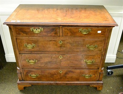 Lot 1384 - A George III walnut four height chest of drawers