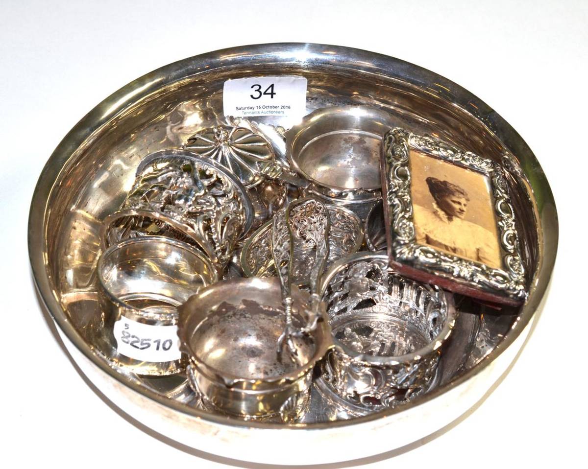 Lot 34 - Silverwares including napkin rings, mustard pot, small photograph frame, foreign white metal...