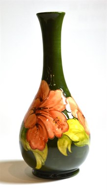 Lot 38 - A Walter Moorcroft Coral Hibiscus on green ground vase