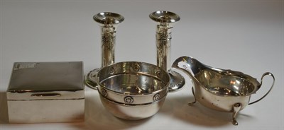 Lot 46 - Silverwares comprising engine engraved cigarette box, pair of candlesticks, sauce boat and circular