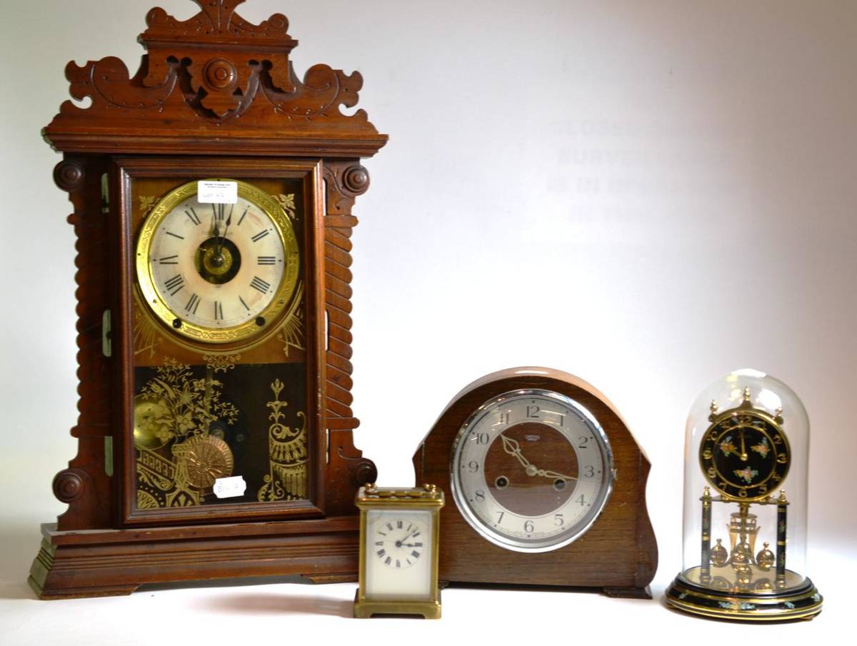 Lot 47 - Brass carriage clock, anniversary clock, an oak cased mantel clock and an American mantel clock (4)