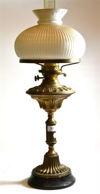 Lot 93 - A Victorian brass oil lamp with white opaque glass fluted shade
