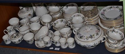 Lot 103 - A Royal Worcester June Garland dinner and tea service