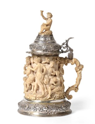 Lot 133 - A German Silver Mounted Carved Ivory Tankard, the foot struck with pseudo marks, probably...