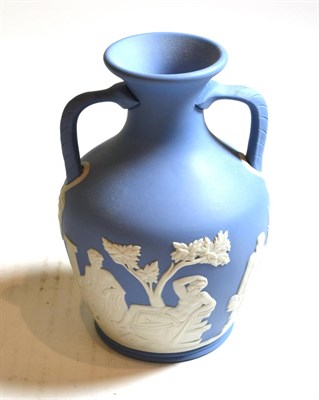 Lot 127 - A Wedgwood pale blue and white Jasper miniature Portland vase, limited edition 110/600 (6";) in...
