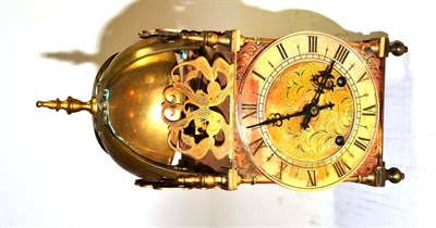 Lot 145 - Brass lantern clock