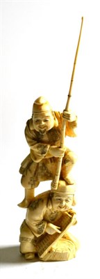 Lot 157 - A Japanese ivory okimono of fishermen, early 20th century, 17cm high