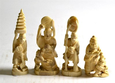 Lot 171 - Three late 19th/early 20th century Japanese ivory okimonos and a figure group