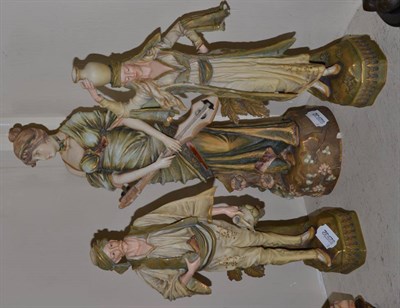 Lot 204 - A pair of Austrian figures by E.W., together with another (3)