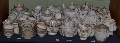 Lot 209 - A large collection of 19th century English gilt embellished pottery and porcelain tea and...