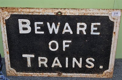 Lot 216 - A cast iron 'Beware of Trains' sign