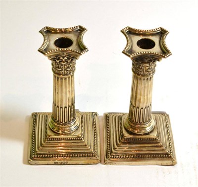 Lot 219 - Pair silver column candlesticks