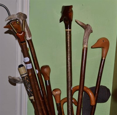 Lot 222 - A handmade collection of fourteen walking sticks and four crops together with an umbrella (19)