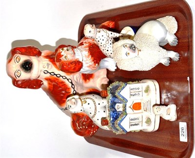 Lot 226 - A Staffordshire dog with open leg at the front, two Dalmatians, two Poodles, a Spaniel and a...