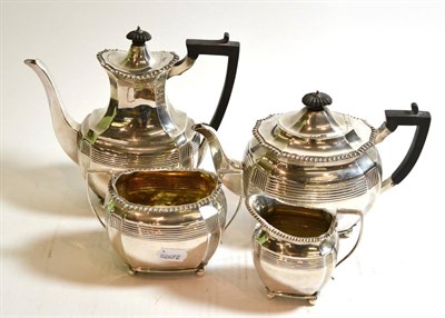 Lot 227 - A silver four piece tea service comprising coffee pot, teapot, milk jug and sugar bowl