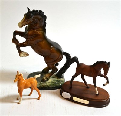 Lot 237 - Beswick figure rearing horse, Doulton foal and Doulton figure 'Springtime'