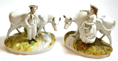 Lot 250 - Pair of Staffordshire figure groups, rustic figures with cows beside a stream