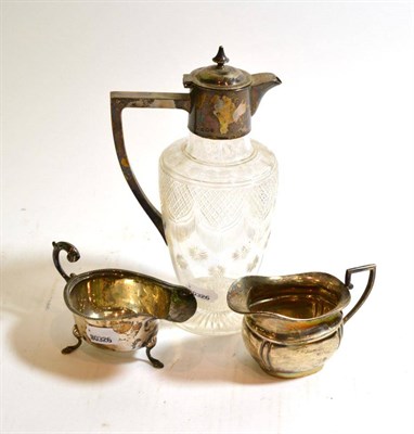 Lot 263 - Silver and cut glass decanter and two silver sauce boats