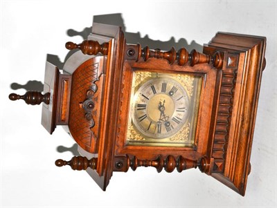 Lot 277 - A German walnut mantel clock, striking on a gong