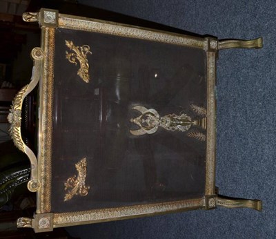 Lot 1017 - Gilt brass fire screen in Empire style