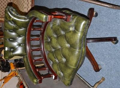 Lot 1018 - A reproduction mahogany and green leather swivel office chair