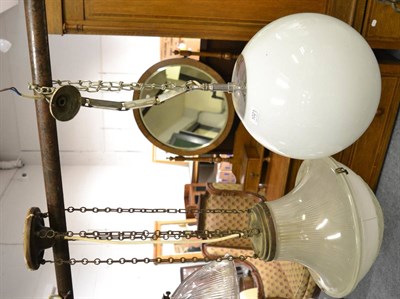 Lot 1021 - An opaque glass pendant light fitting moulded with acanthus leaf tips and fluting, with metal chain