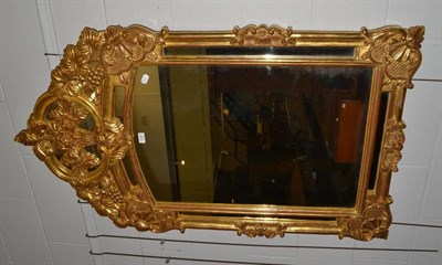 Lot 1033 - A reproduction gilt framed over mantel mirror