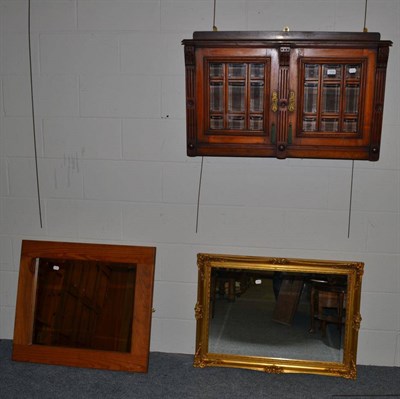 Lot 1034 - Modern glazed wall cupboard and two mirrors