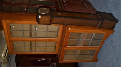 Lot 1046 - A chiming small longcase clock and a glazed bookcase