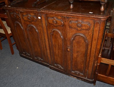 Lot 1066 - A pair of Victorian walnut side cabinets with moulded panel doors enclosing four drawers