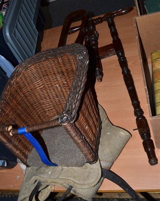 Lot 1101 - A child's basket saddle and a mahogany boot jack