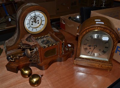 Lot 1107 - A Dutch style wall clock, an oak veneered striking wall clock, movement stamped W & H and...