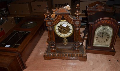 Lot 1109 - An Art Nouveau German striking table clock, movement stamped Junghans, an American Ansonia striking