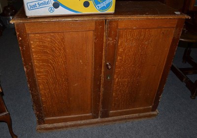 Lot 1117 - Scumbled pine two door cupboard