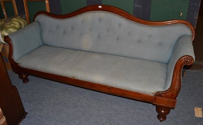 Lot 1121 - A Victorian mahogany settee with an upholstered backrest with waved top rail, upholstered arms...