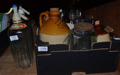 Lot 1149 - A quantity of old bottles, syphons and stoneware flagon